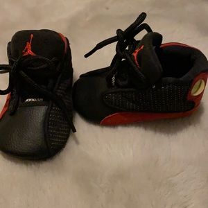 Black and red infant Jordans